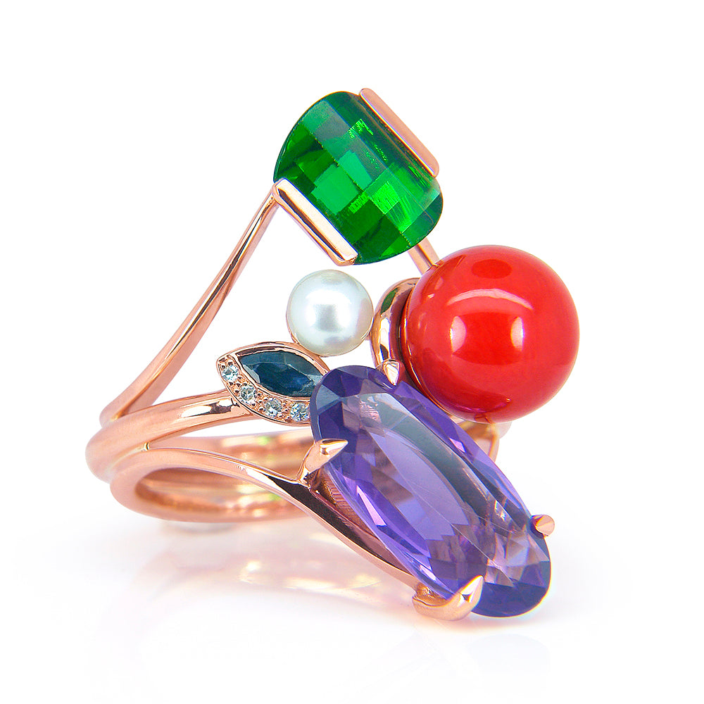 A bespoke cocktail ring, highly crafted in the UK using 18ct rose Fairtrade Gold and a selection of upcycled coloured gemstones