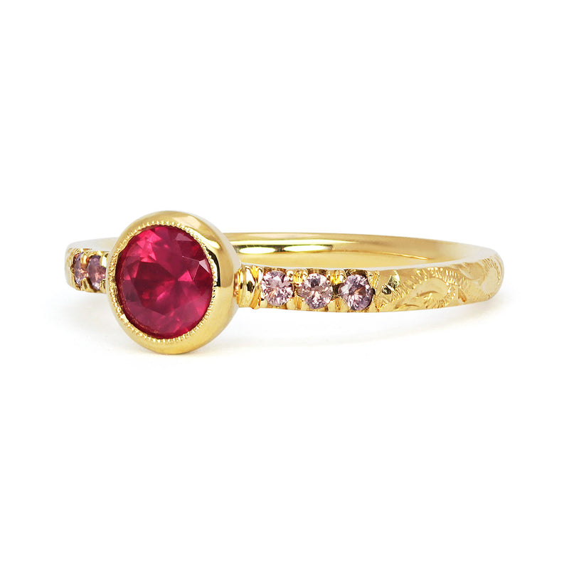 Bespoke Laurence customised Hebe engagement ring in 18ct recycled yellow gold with hand-engraved scrolls, a fair-trade Malawi ruby and ethical cognac sapphires
