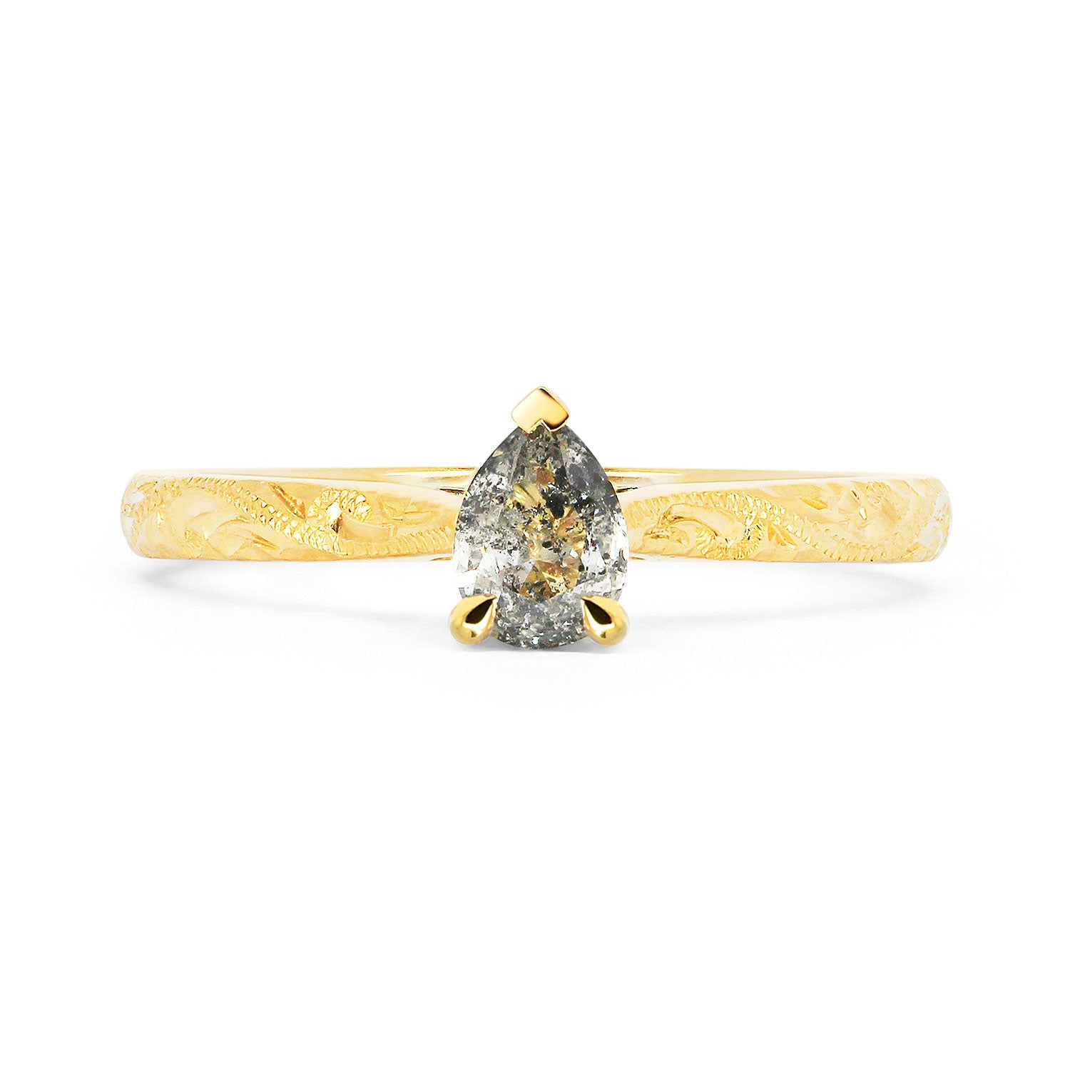 Fancy Athena ethical solitaire engagement ring in 18ct recycled yellow gold, hand-engraved and set with a pear-cut salt and pepper diamond of traceable and conflict-free Canadian provenance