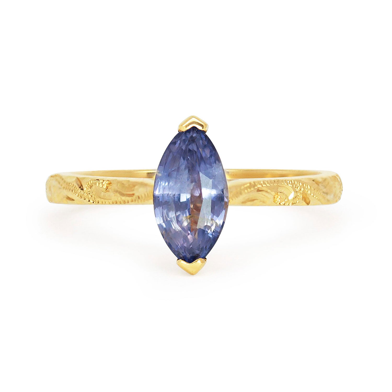 Fancy Athena ethical solitaire engagement ring in 18ct yellow Fairtrade Gold, hand-engraved and set with a blue marquise sapphire of fair-traded and traceable Sri Lankan provenance