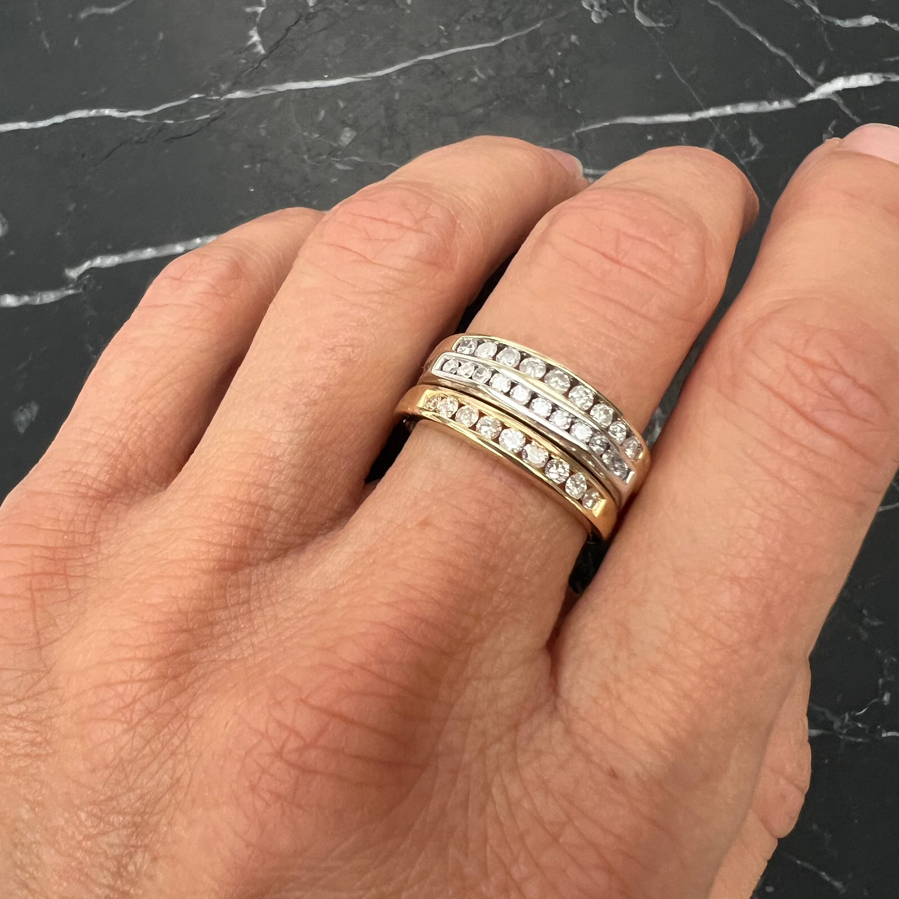 A unique commitment ring, made by soldering together three antique Victorian gold and old-cut diamond channel-set eternity rings, reclaimed and repurposed, on hand