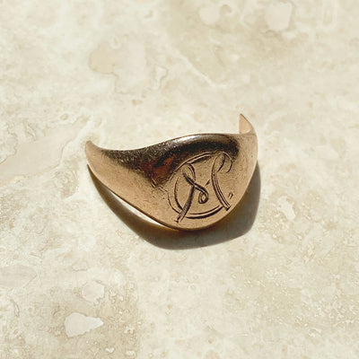 An old family signet ring, hand-engraved with an 'M', cast in 9ct rose gold and very worn over time. This ring was melted down and recycled as Mark's new wedding band, 2