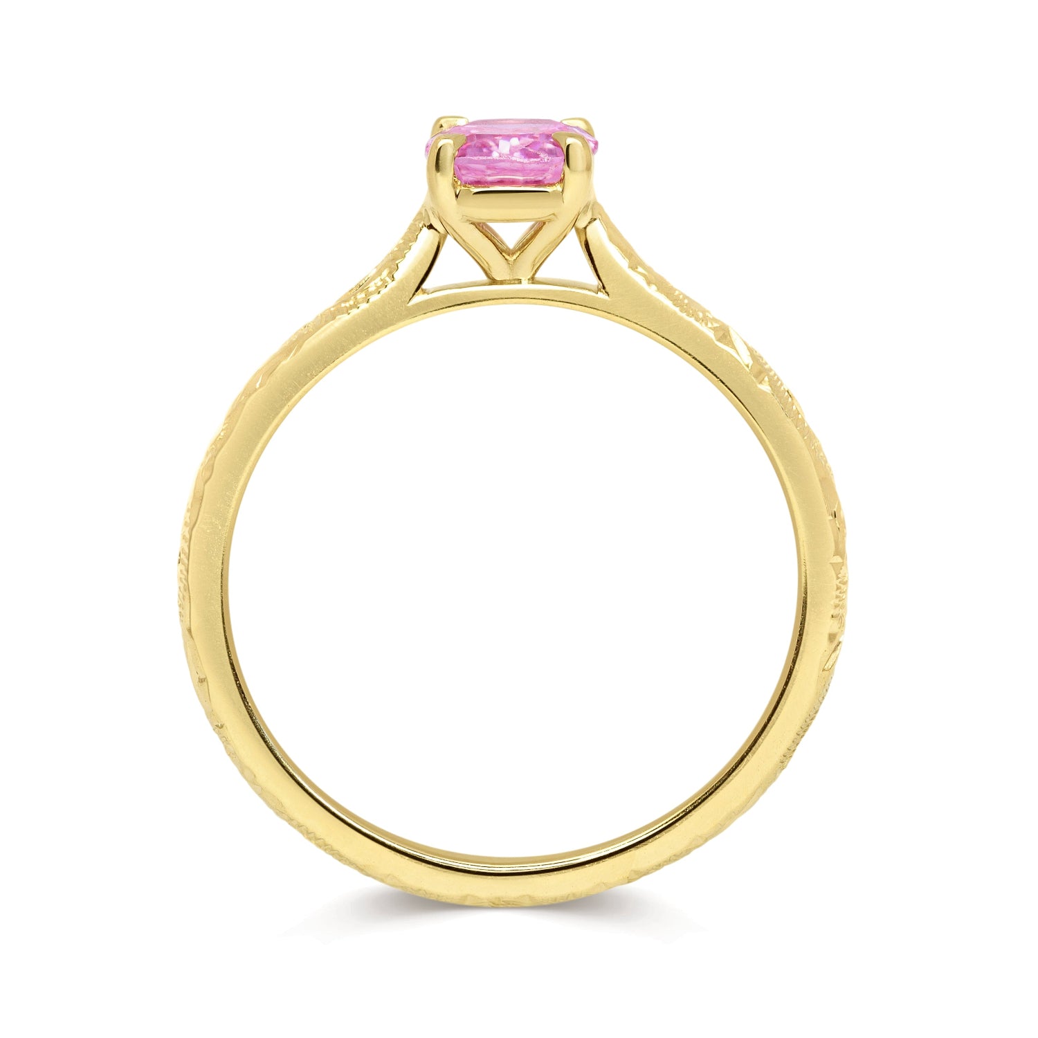 Solitaire engagement ring with a pink oval-cut fancy sapphire and an 18ct recycled eco gold band with hand engraving, side view