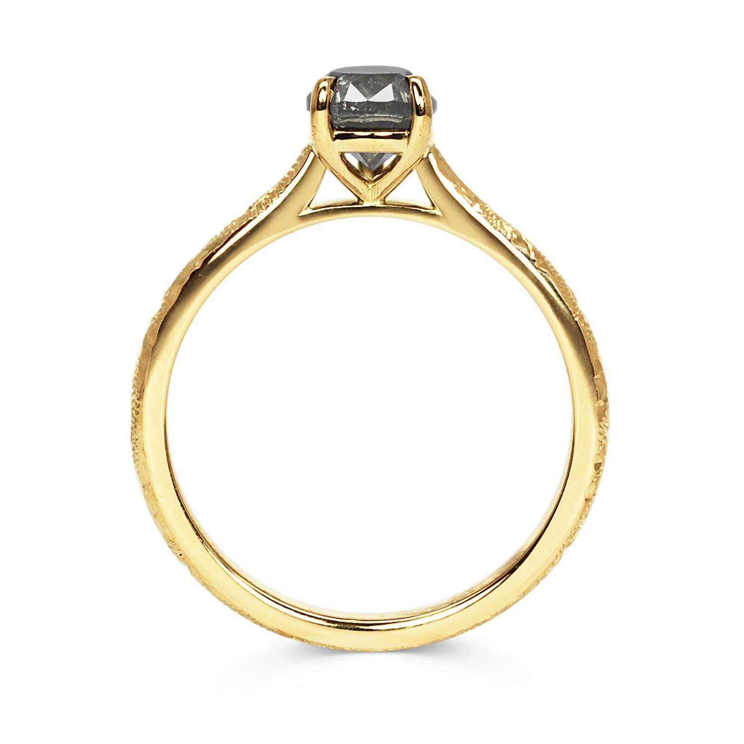 18ct recycled yellow gold solitaire engagement ring with an ethical pear-cut salt and pepper diamond and hand-engraved band, side view