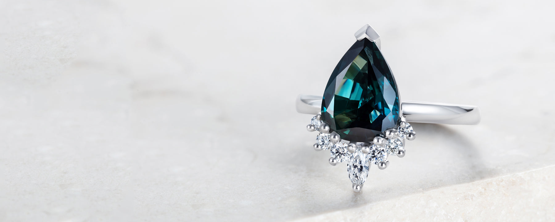 Ethical Engagement Ring with blue pear shape sapphire and Canadian diamonds