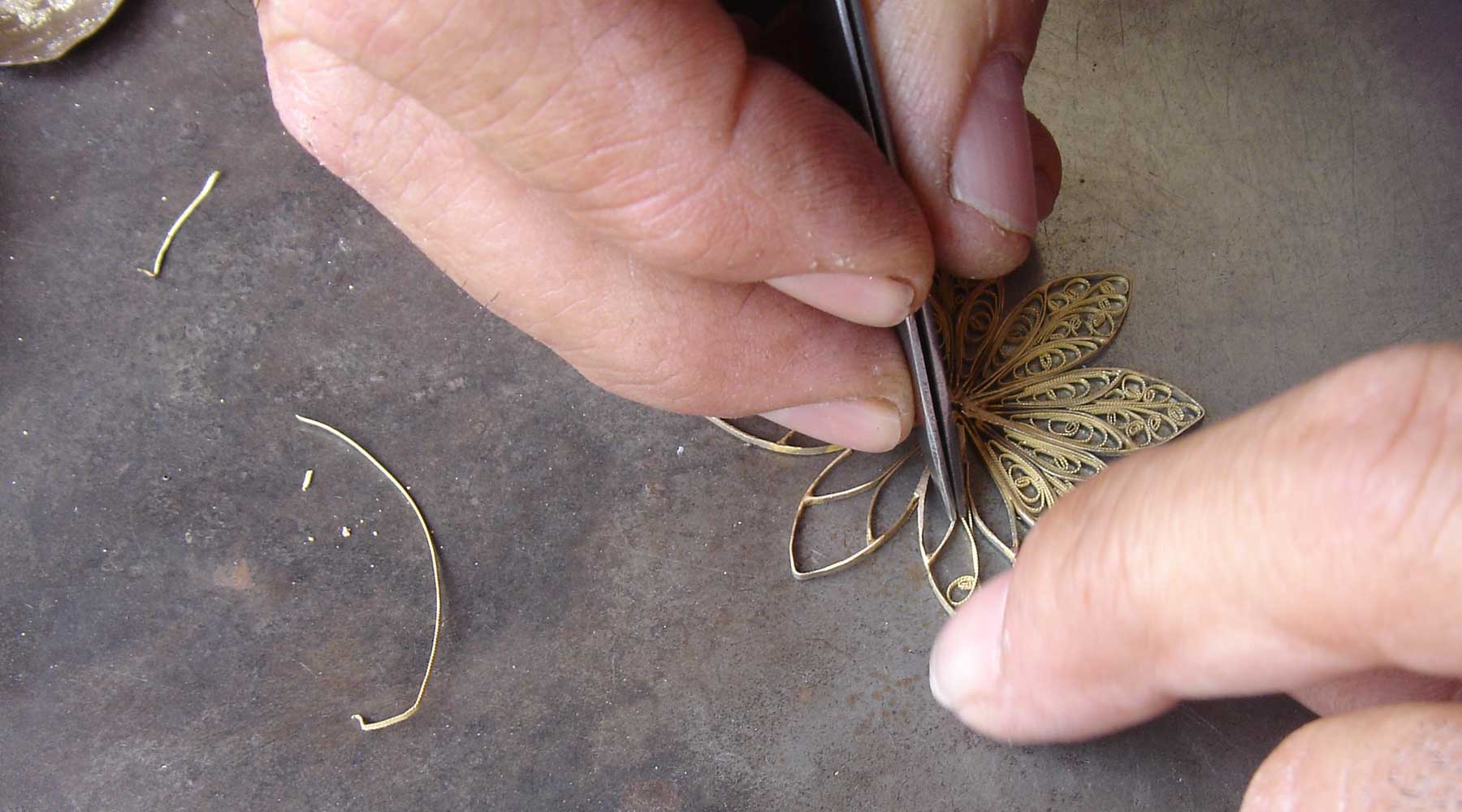 Master filigree artisan Lorenzo painstakingly handcrafts a filigree rosette