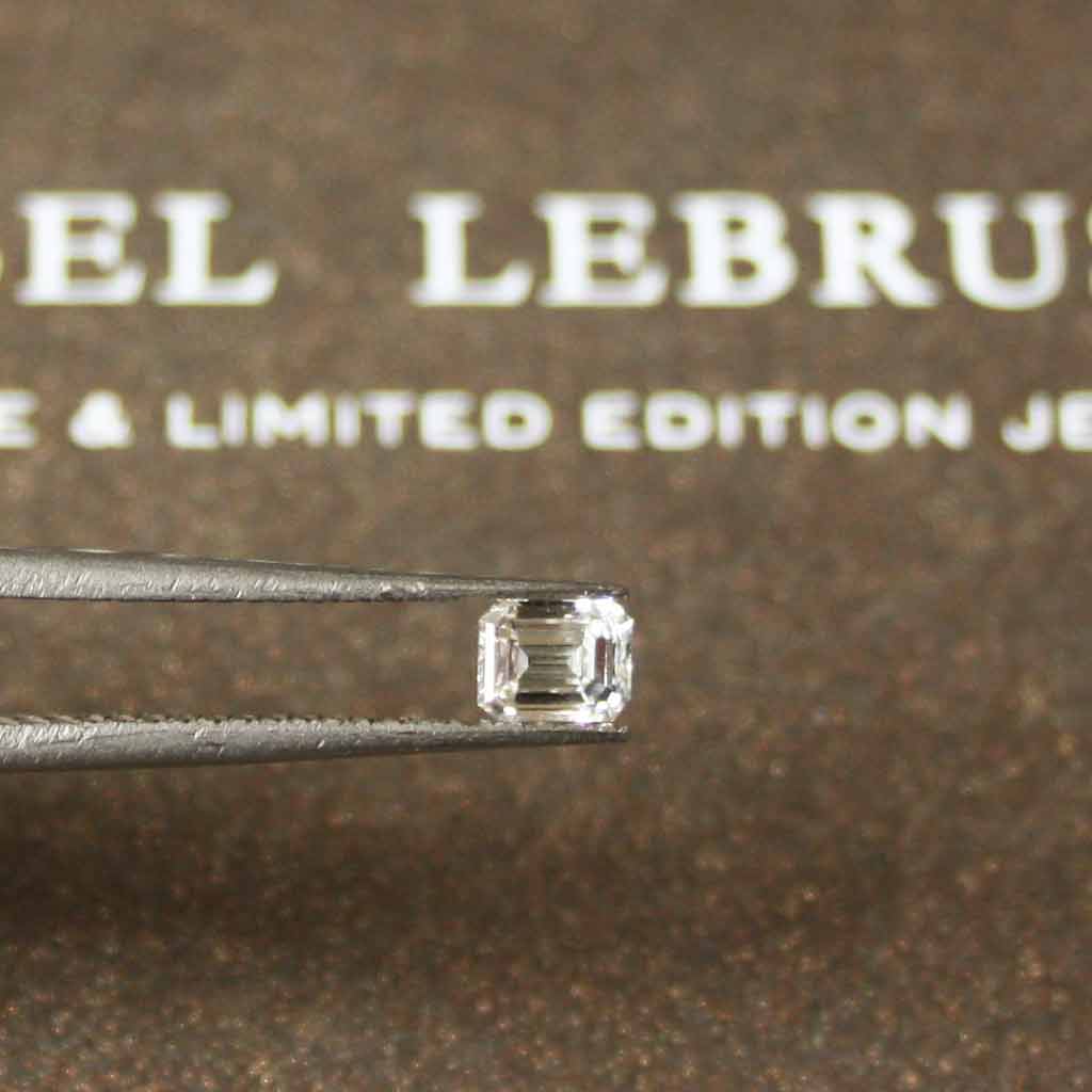 An emerald-cut lab-grown diamond, ready to be set into a unique and ethical bespoke engagement ring