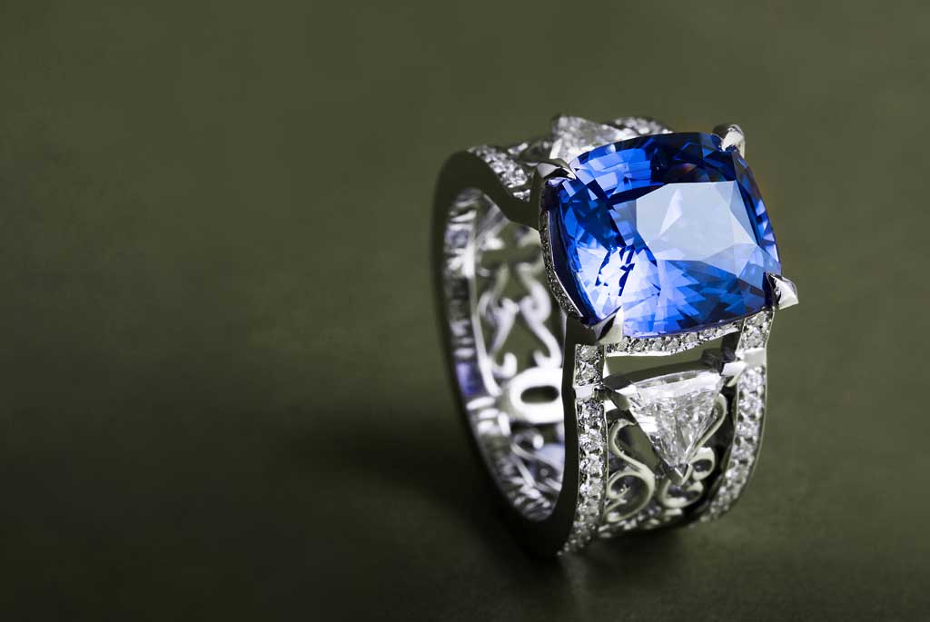 Bespoke cocktail ring cast in 18ct white ethical gold and set with conflict-free diamonds and a fair-traded blue cushion-cut sapphire