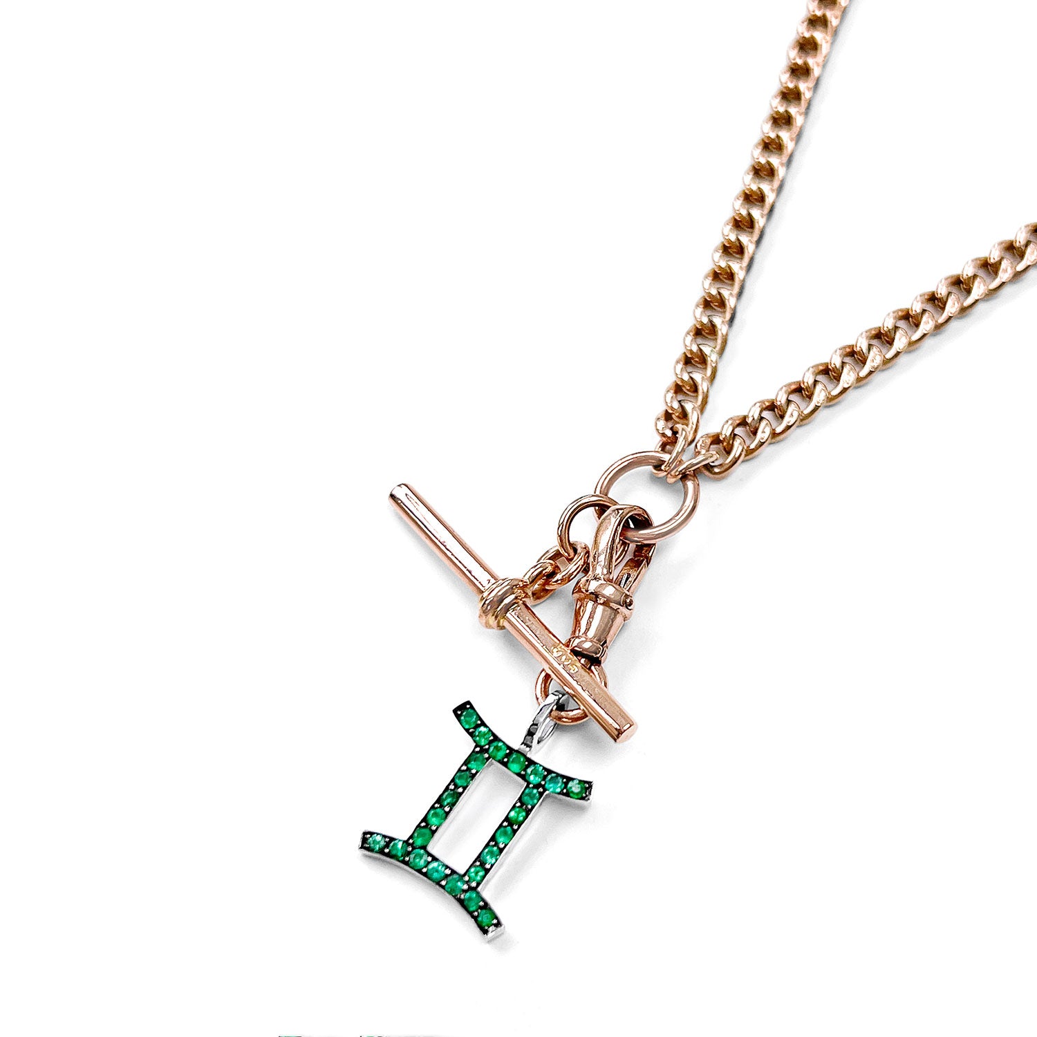 Rose gold reclaimed antique Victorian chain necklace necklace with an ethical green emerald Gemini pendant on a white background