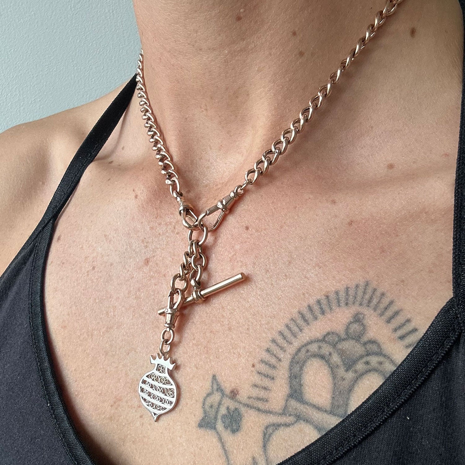 Unique necklace crafted using sustainable recycled rose gold, a repurposed antique Victorian T-bar clasp and a one-off hand-crafted filigree charm depicting a beehive, modelled on body