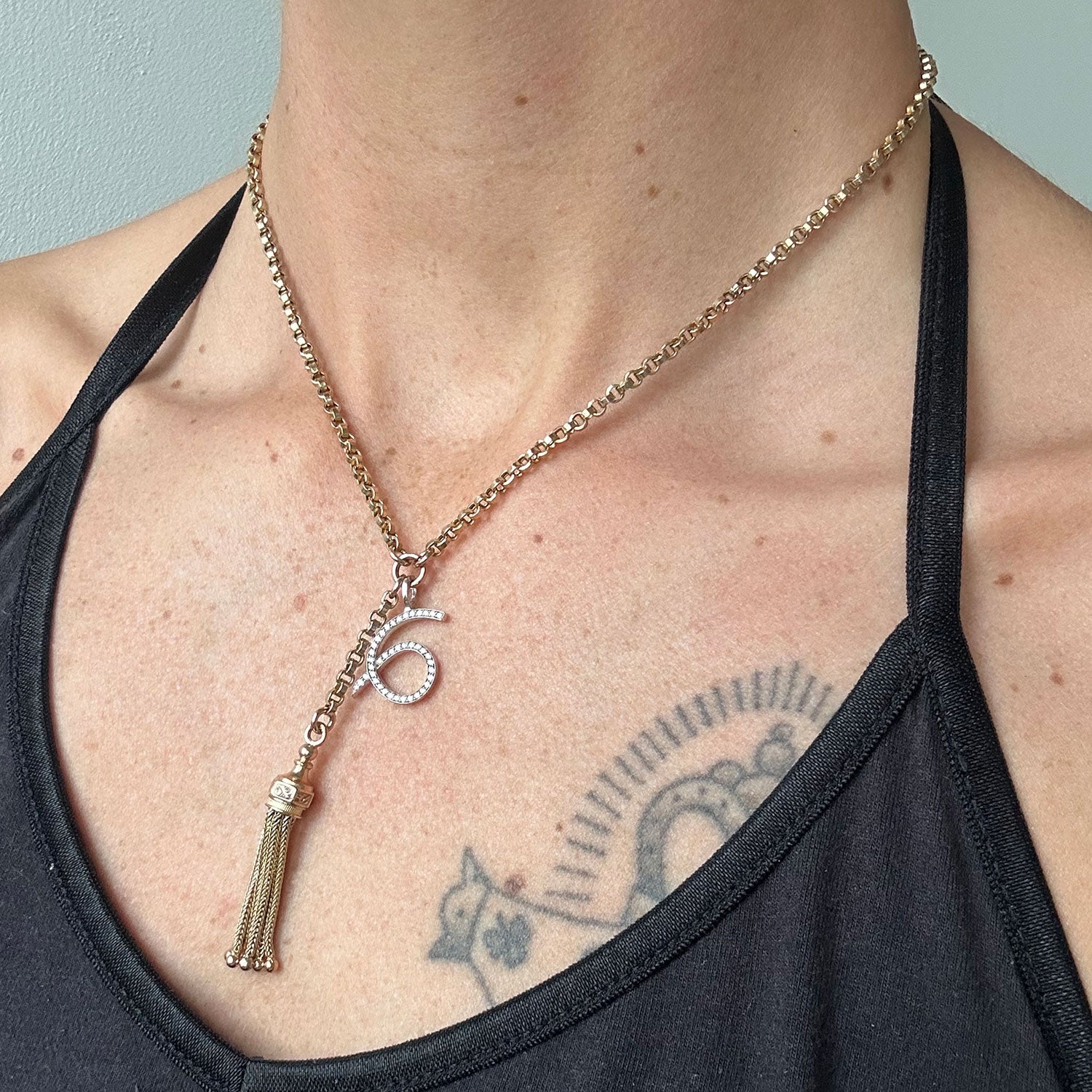 Reclaimed Vintage unique necklace with antique Victorian 9ct gold tassel pendant, 9ct recycled gold chain and a new numerology pendant crafted in recycled gold and conflict-free diamonds, modelled on body