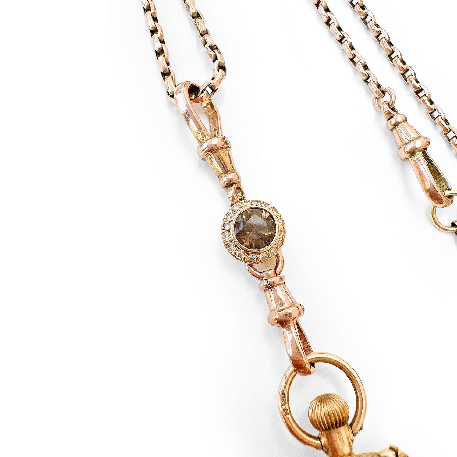 Reclaimed Vintage antique Victotrian pocket watch with Roman numerals and a decorative 'A', set with broken diamonds - repurposed as a pendant on a reclaimed antique gold chain and Albert clasp - close-up of chocolate diamond connector pendant