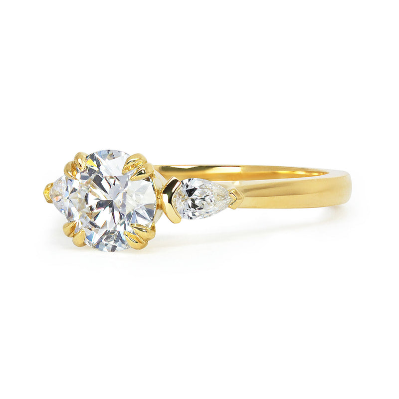 Mark Dearing's bespoke lab-grown diamond trilogy engagement ring with pear-cut artisanal Ocean Diamonds side stones