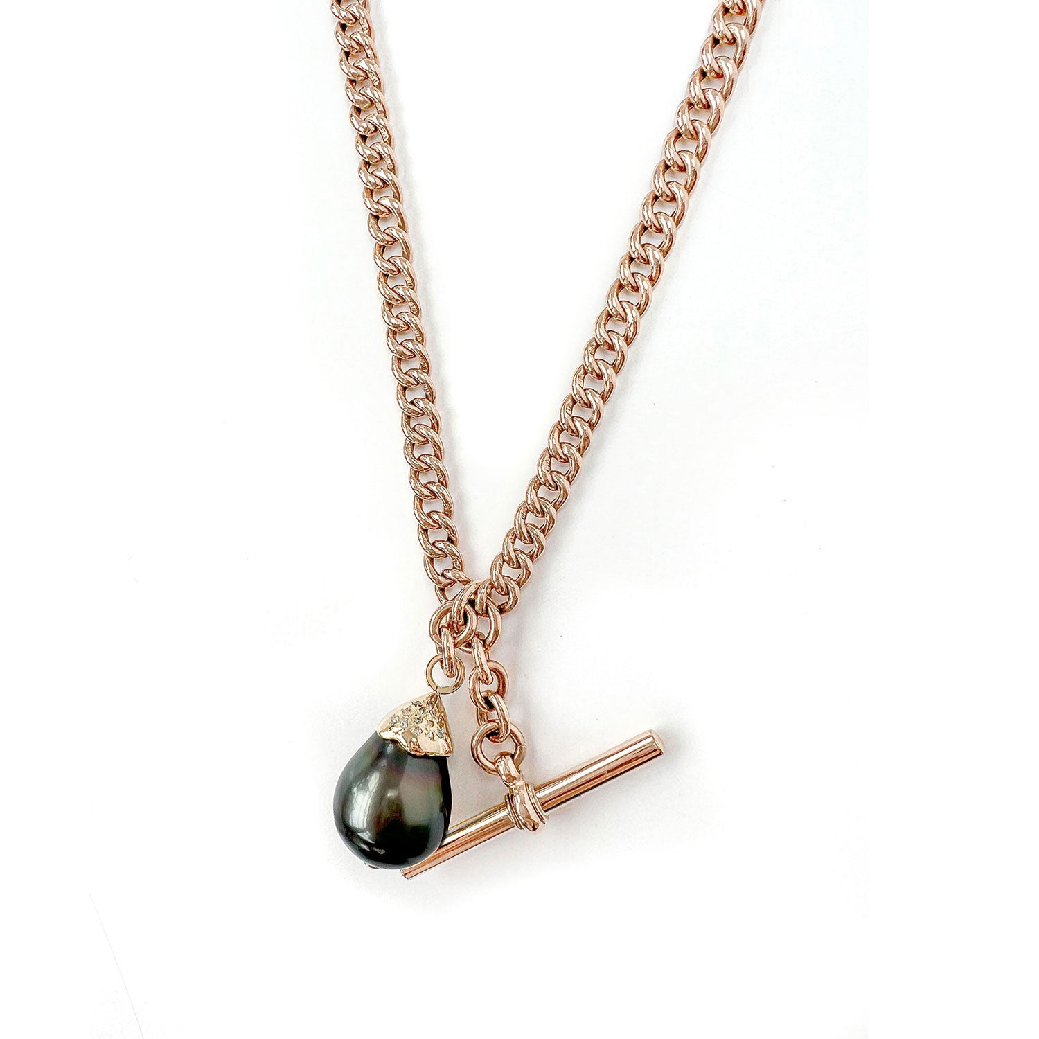 Unique pendant, crafted from recycled rose gold chain, an upcycled repurposed antique Victorian T-bar clasp and an eco-friendly black Tahitian pearl in a 'drop' setting embellished with reclaimed broken diamonds