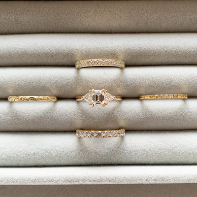 Bespoke Steve trilogy engagement ring, 18ct yellow Fairmined Ecological Gold, 0.7ct Canadamark emerald-cut diamond and trillion-cut artisanal Ocean Diamonds lifestyle