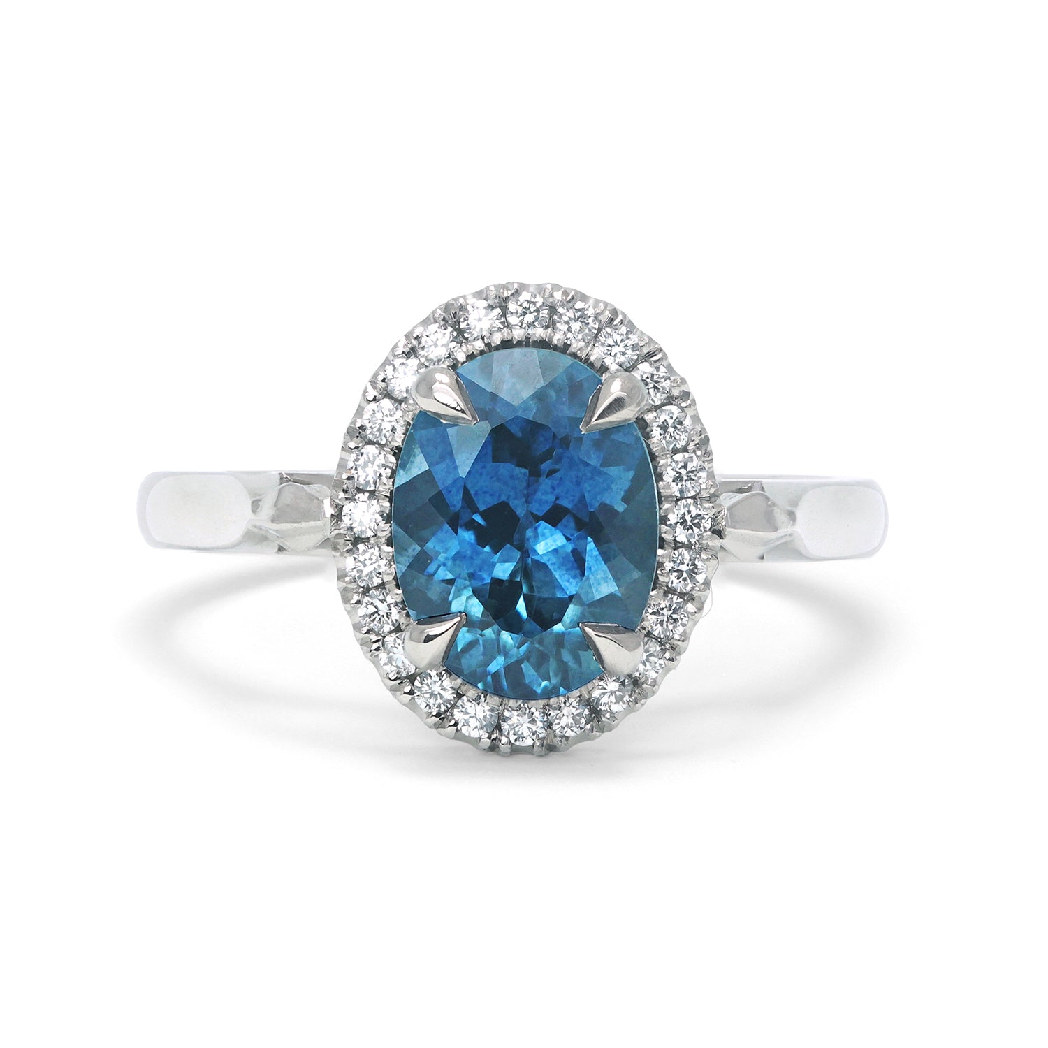 Bespoke Robert Ethical Sapphire Halo Engagement Ring, 100% recycled platinum, conflict-free Canadian diamonds and an oval-cut fair-traded Malawi sapphire
