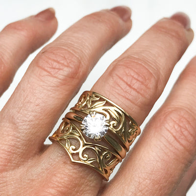 Artisan Filigree Ethical Gold Commitment Ring on hand, stacked with Artisan solitaire engagement ring and Filigree Artisan Wishbone ring
