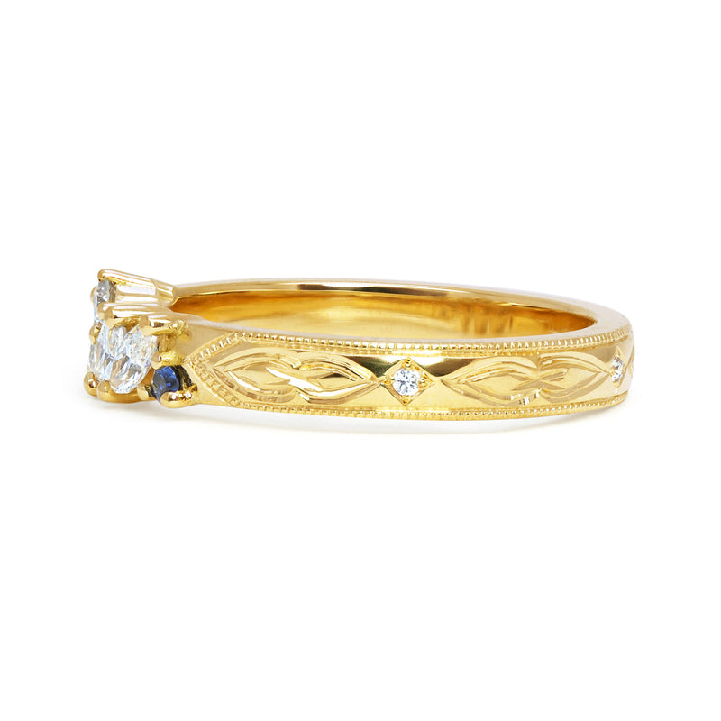 Louise Clarke bespoke hand-engraved wedding band, 18ct yellow Fairtrade Gold, marquise Canadian diamonds, artisanal Ocean Diamonds and fair-traded blue sapphires