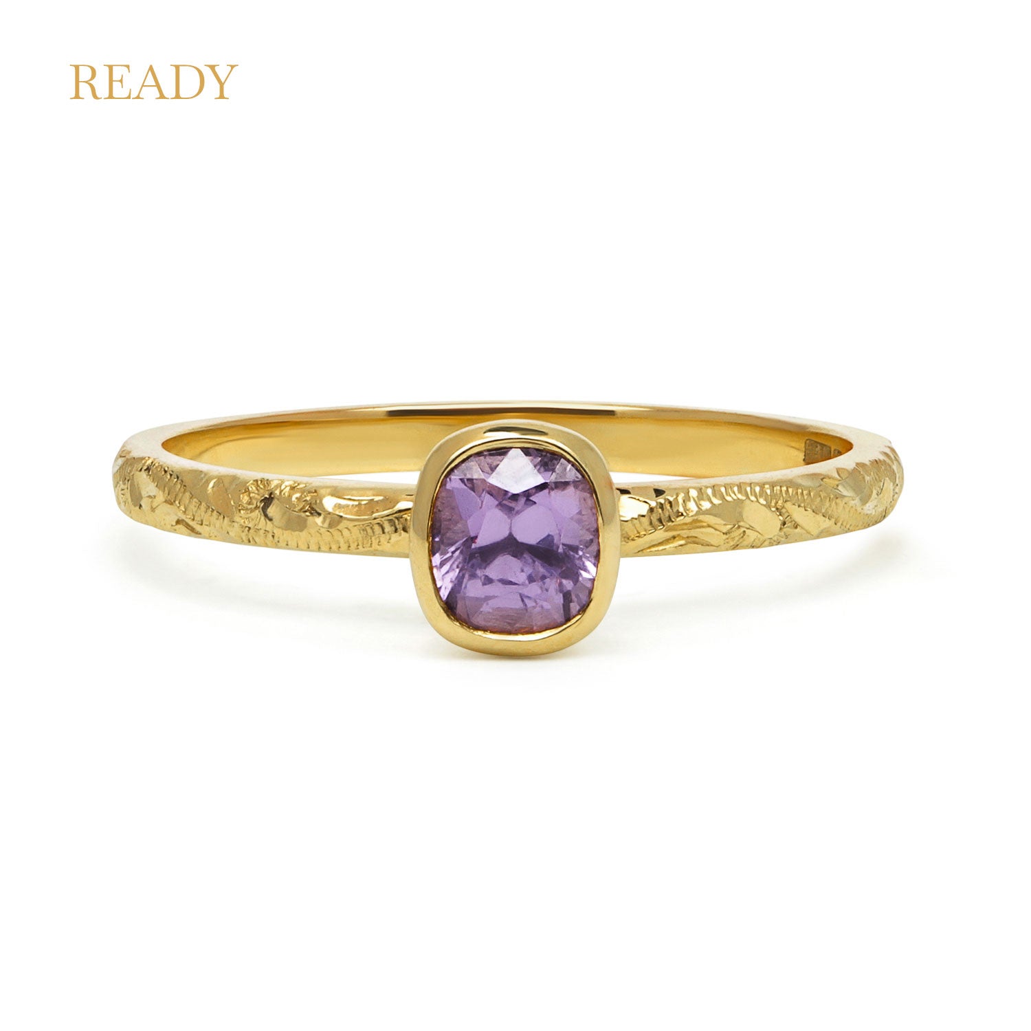 Fancy Hera ethical solitaire engagement ring in 18ct recycled yellow gold, hand-engraved and set with a purple cushion-cut spinel of fair-traded and traceable Sri Lankan provenance
