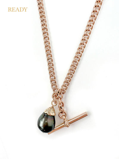 Unique pendant, crafted from recycled rose gold chain, an upcycled repurposed antique Victorian T-bar clasp and an eco-friendly black Tahitian pearl in a 'drop' setting embellished with reclaimed broken diamonds
