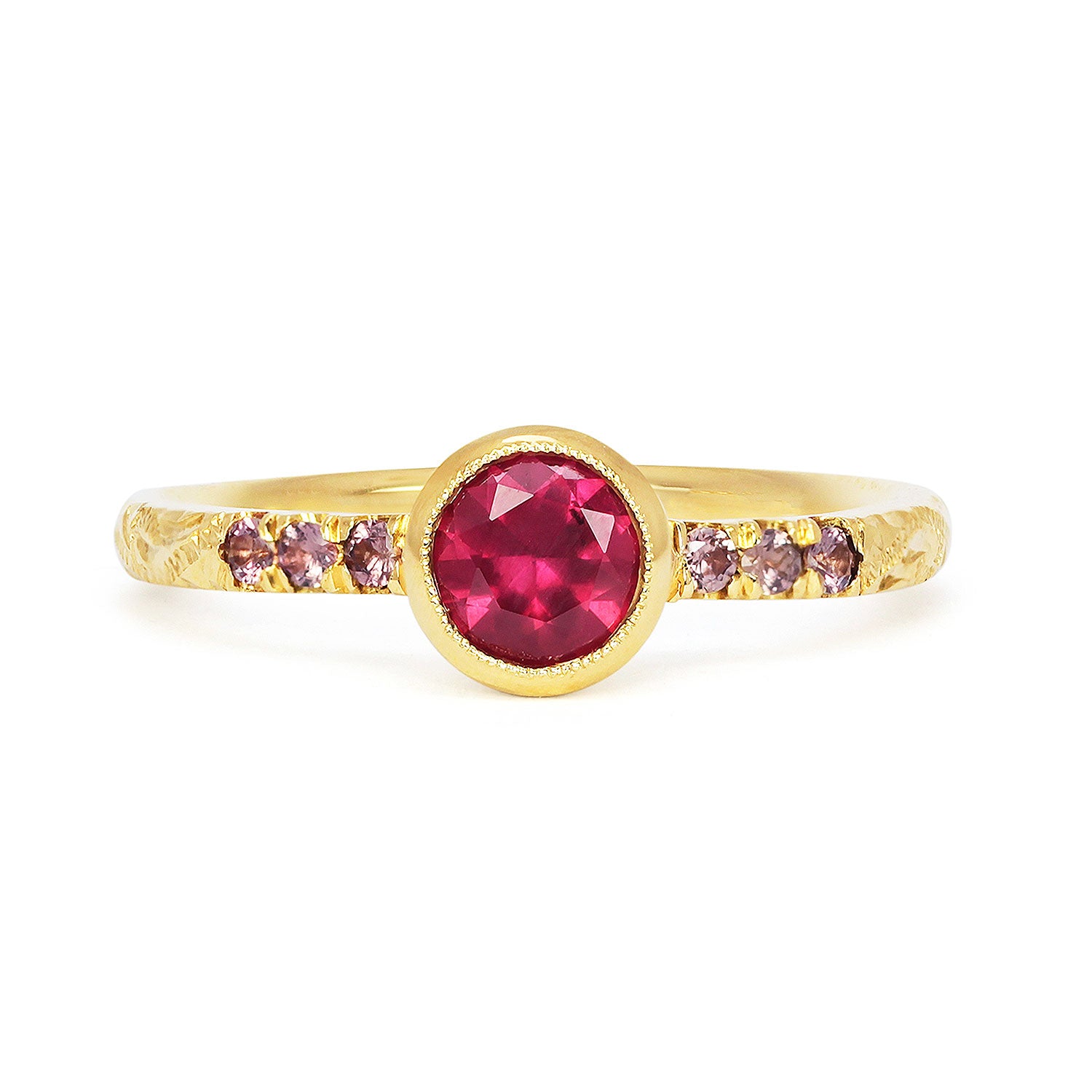 Bespoke Laurence customised Hebe engagement ring in 18ct recycled yellow gold with hand-engraved scrolls, a fair-trade Malawi ruby and ethical cognac sapphires