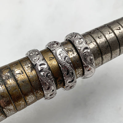 A trio of hand-engraved friendship rings, cast in 9ct recycled white gold, remodelled from our clients' late mother's ring 4