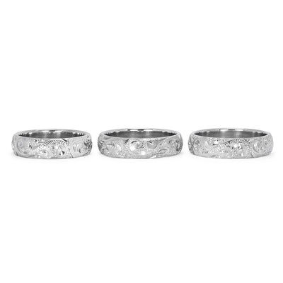 A trio of hand-engraved friendship rings, cast in 9ct recycled white gold, remodelled from our clients' late mother's ring