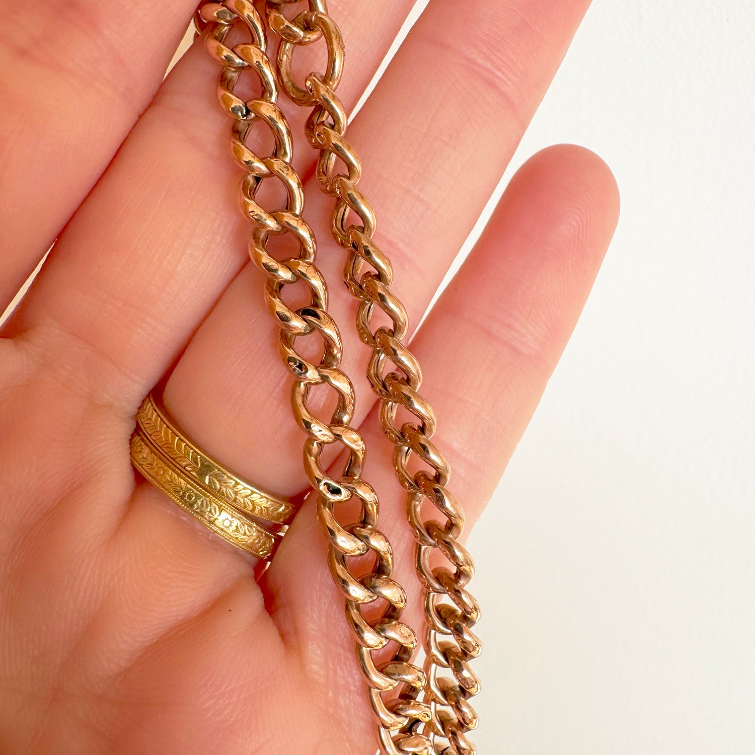 Unique necklace crafted using sustainable recycled rose gold, a repurposed antique Victorian T-bar clasp and a one-off hand-crafted filigree charm depicting a beehive, chunky chain view