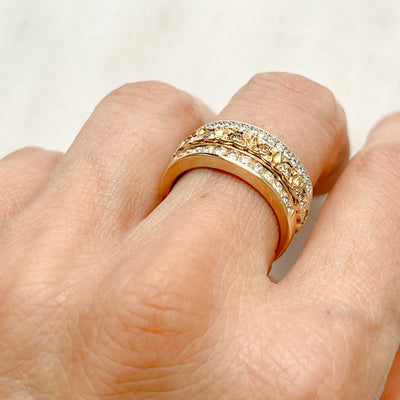 Three antique 9ct gold Victorian eternity rings half-set with diamonds, soldered together into a chunky stack, on hand, POV
