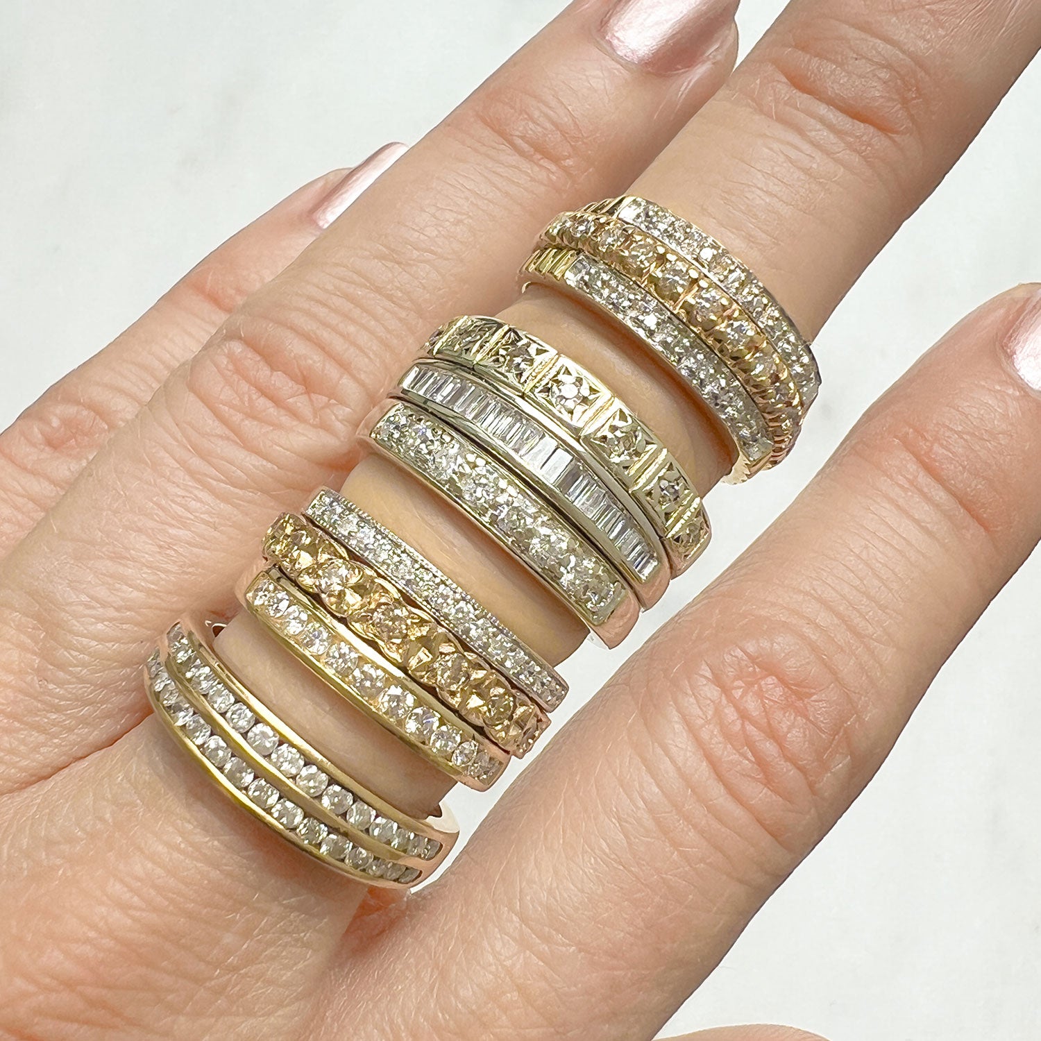 Reclaimed Vintage commitment rings, uniting antique Victorian half-diamond eternity rings
