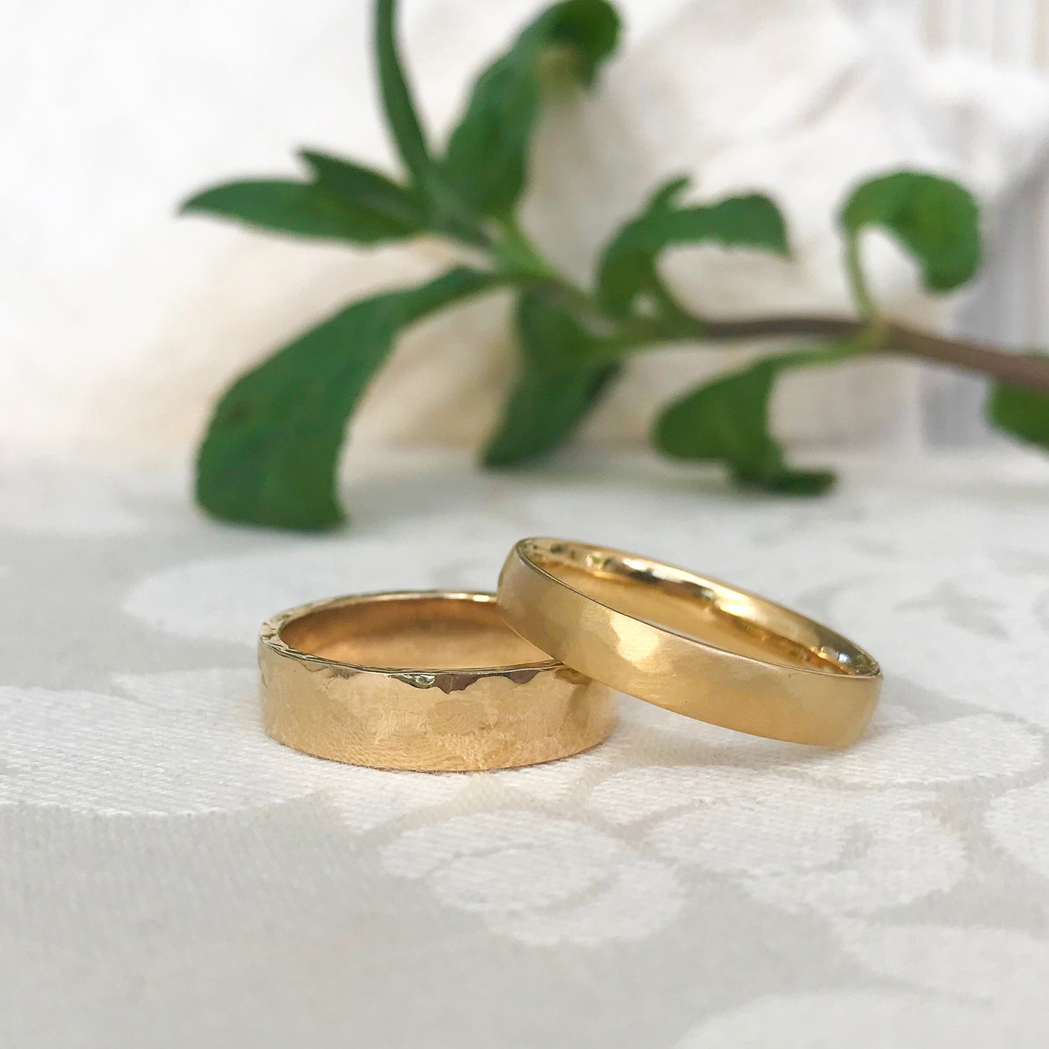 Ethical gold men's wedding bands with soft-hammered and hard-hammered finishes
