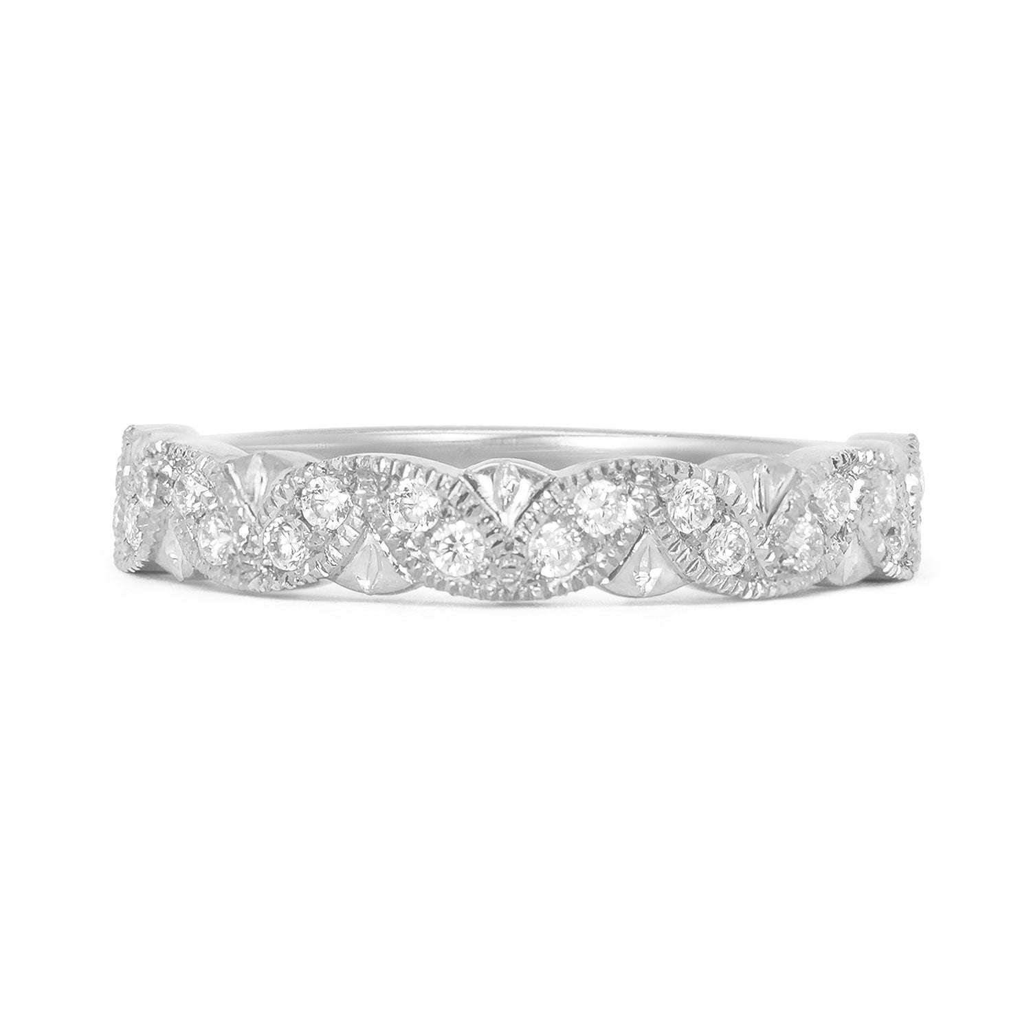 Lebrusan Studio's Amare Rosa wedding band, cast in recycled platinum and set with conflict-free Canadian diamonds in hand-engraved marquise-shaped settings