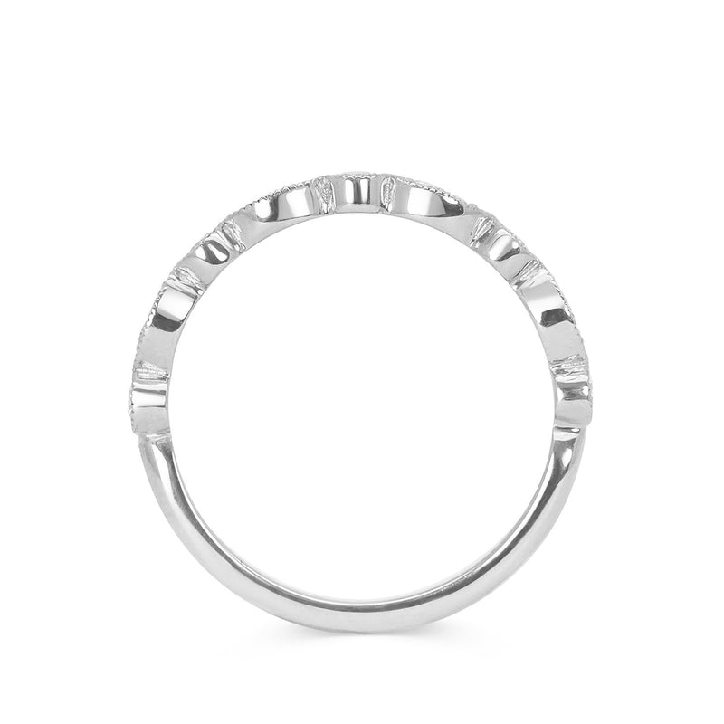 Lebrusan Studio's Amare Marquise wedding band in recycled platinum. Conflict-free Canadian diamonds are set into round and marquise-shaped settings with hand-engraved milgrain beading around the edges