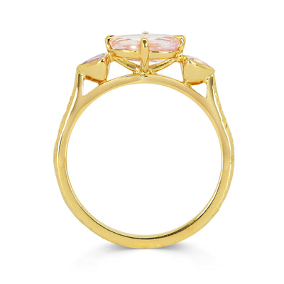Lebrusan Studio Fancy Athena trilogy engagement ring with hand-engraved 18ct Fairmined Eco Gold, a cushion-cut pink sapphire and two trillion-cut pink sapphires, side view