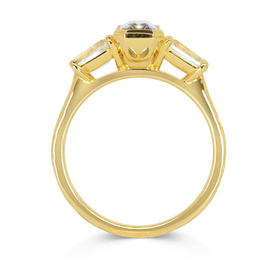 Lebrusan Studio Fancy Athena trilogy engagement ring with hand-engraved 18ct yellow Fairmined Eco Gold band and three emerald cut grey sapphires of ethical traceable origin, side view