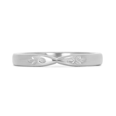 Lebrusan Studio's Amare Florere recycled platinum pinched wedding band, hand engraved with roses