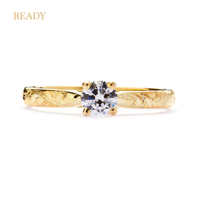 Lebrusan Studio ready to wear Athena solitaire engagement ring with 18ct recycled gold, a reclaimed brilliant-cut diamond and hand-engraved scrolls