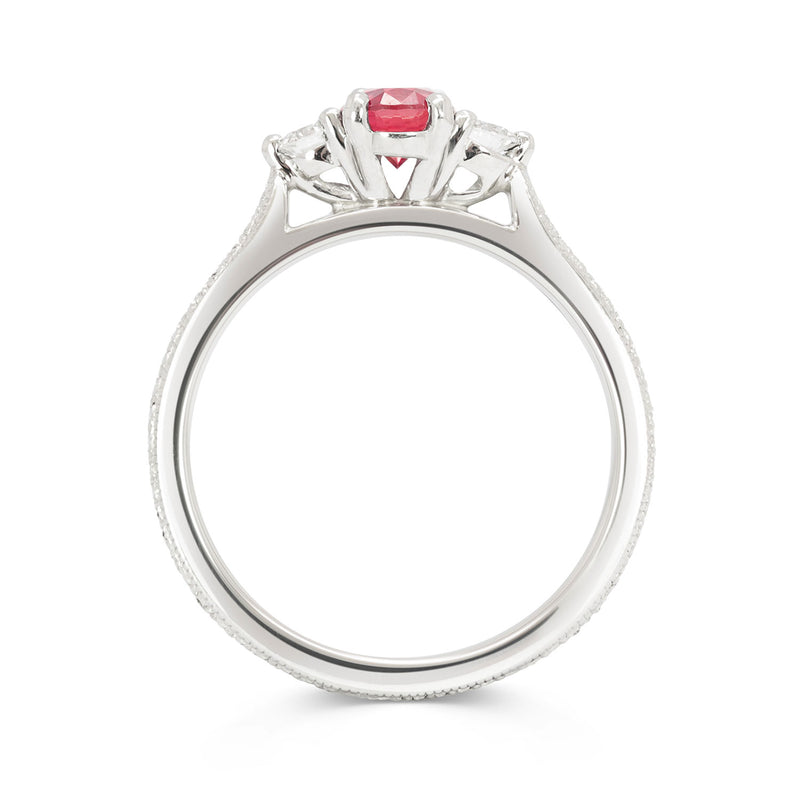 Bespoke Hannah ethical engagement ring, cast in recycled platinum and set with a 0.55ct oval cut Malawi ruby and traceable Canadian diamonds