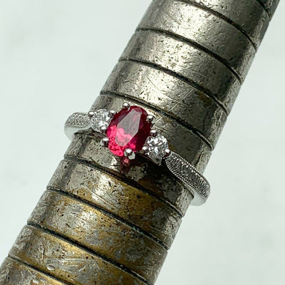 Bespoke Hannah ethical engagement ring, cast in recycled platinum and set with a 0.55ct oval cut Malawi ruby and traceable Canadian diamonds, lifestyle