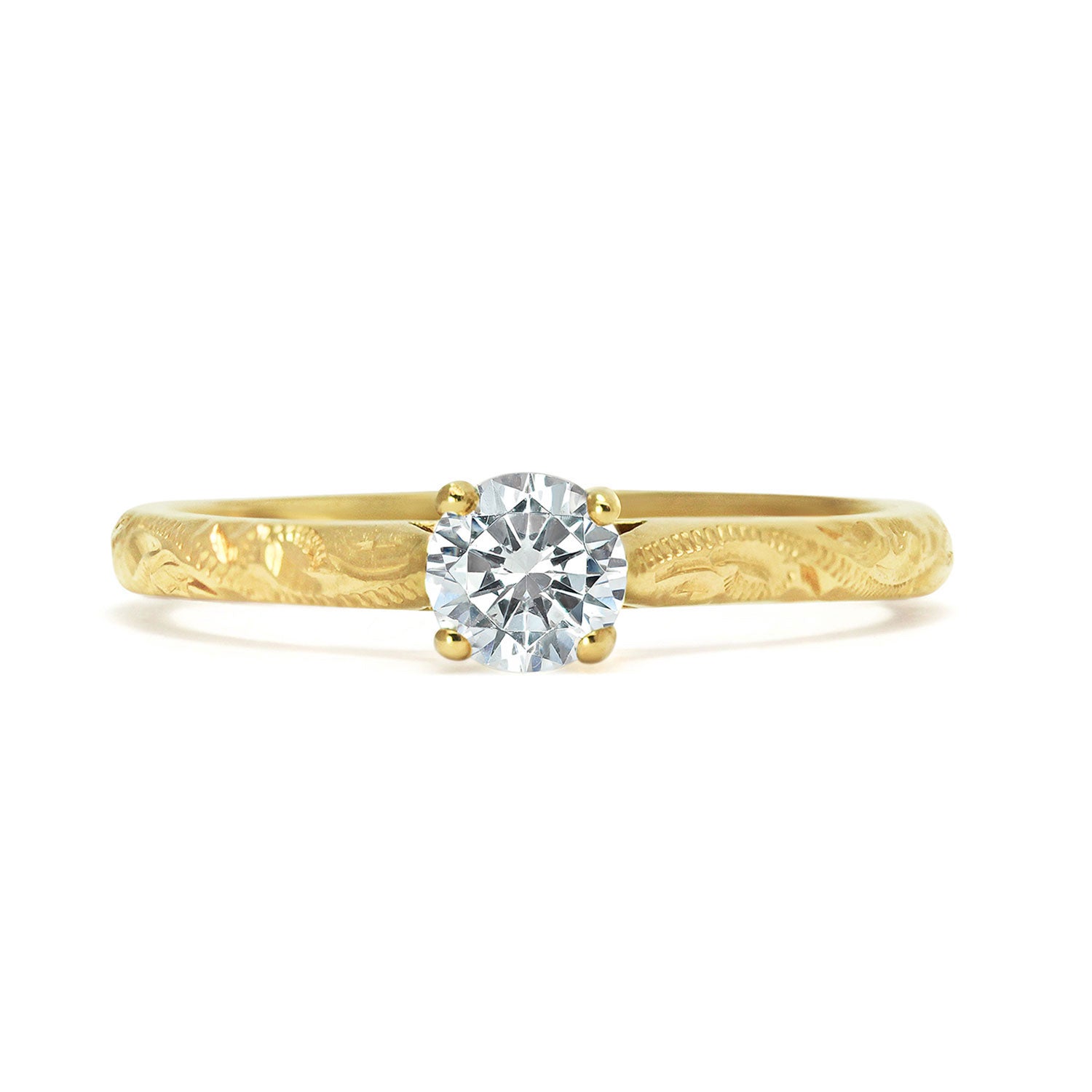 Solitaire engagement ring with a slim 18ct yellow gold band hand-engraved with intricate scrolls, and a 0.33ct round brilliant-cut diamond in a traditional four-claw setting