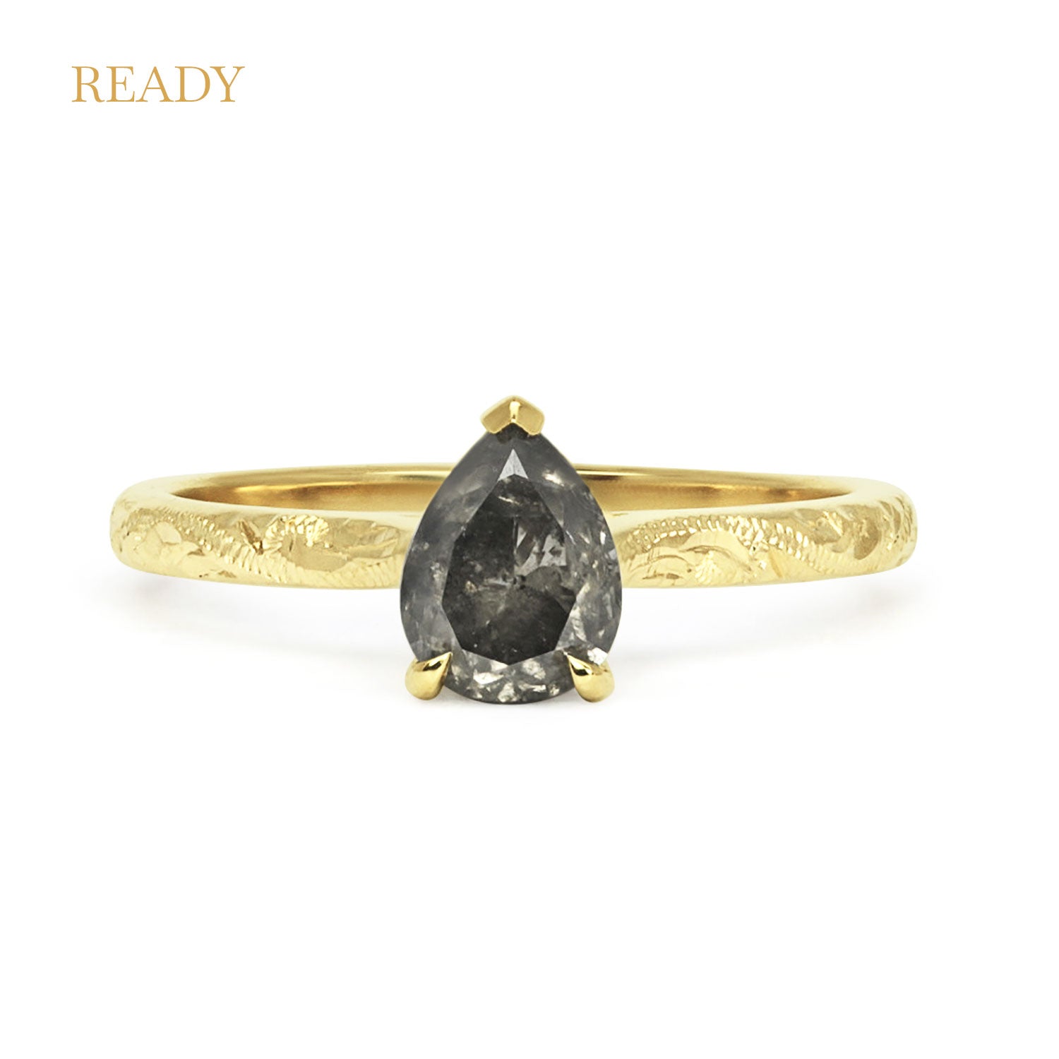 18ct recycled yellow gold solitaire engagement ring with an ethical pear-cut salt and pepper diamond and hand-engraved band