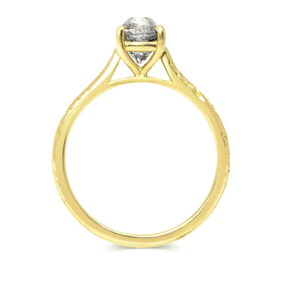 Solitaire engagement ring with a vintage recycled salt and pepper old-cut diamond and an 18ct recycled gold band with hand engraved scrolls, side view