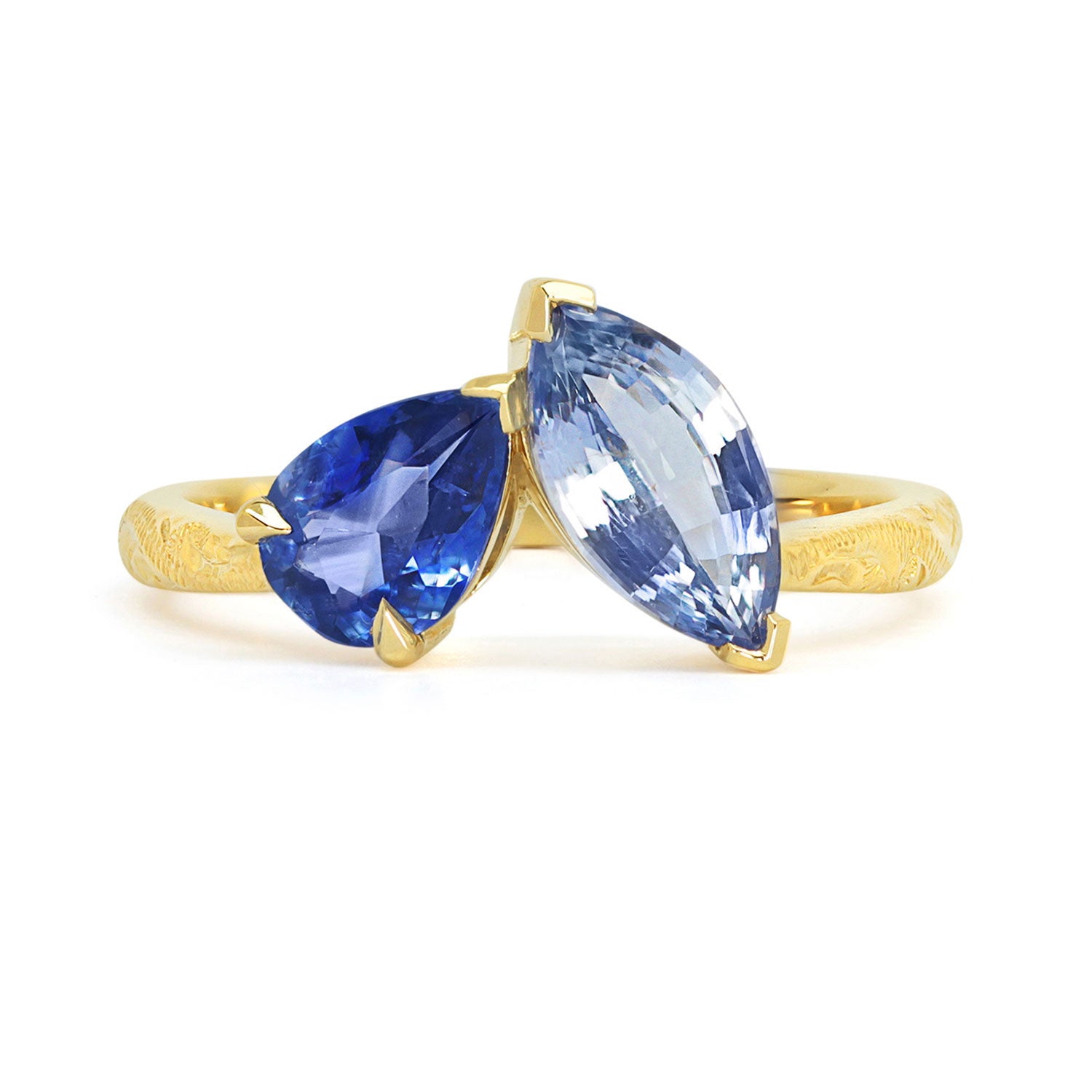 Lebrusan Studio Fancy Athena toi et moi engagement ring with hand-engraved 18ct yellow Fairmined Eco Gold band, a pear-cut blue sapphire and a marquise blue sapphire of ethical traceable origin