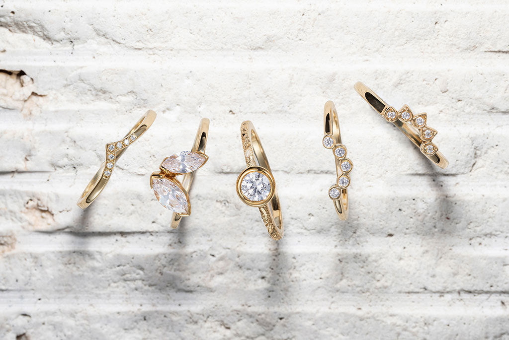 Thin gold stacking rings wedding; unique women's wedding rings. Delicate bands, conflict-free diamonds, sustainable gold and shaped forms make up this collection of wedding bands for solitaire rings