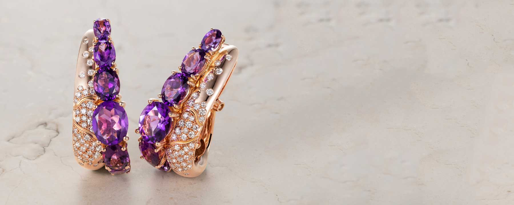 Bespoke earrings in 18ct rose Fairtrade Gold, fair-traded purple amethyst and conflict-free diamonds 