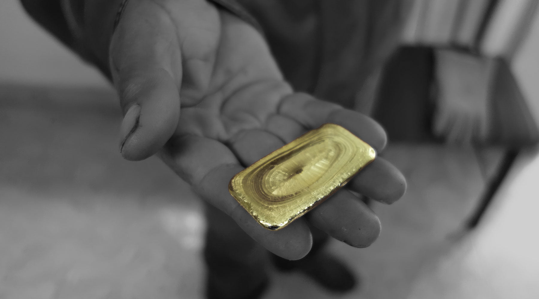 A Fairtrade Gold miner proudly showing his sustainable gold
