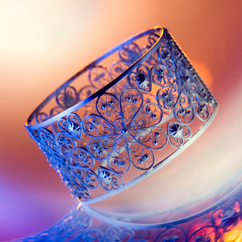 Lebrusan Studio's iconic hand-crafted Spanish filigree rosette bangle on the front cover of Woman & Home with Saira Khan