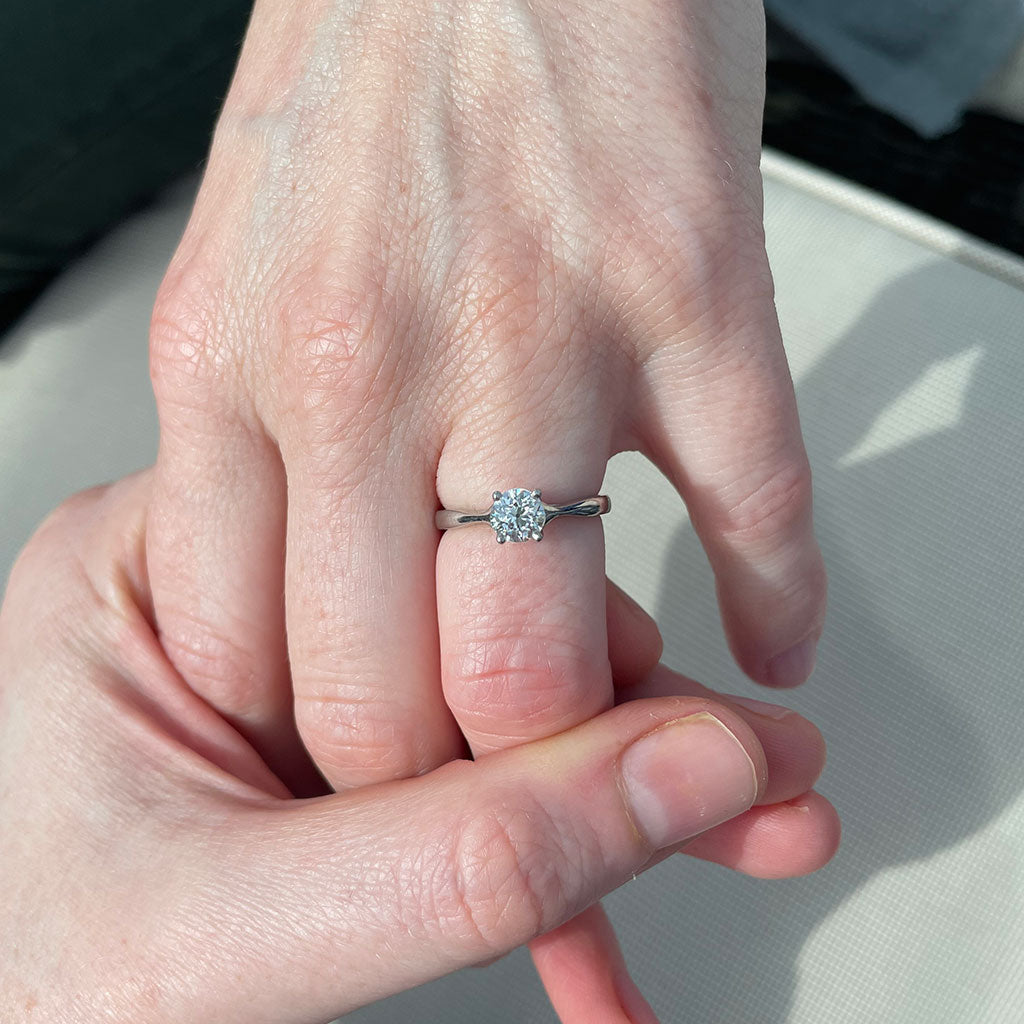 A bespoke diamond solitaire engagement ring, cast in recycled platinum and set with a reclaimed brilliant-cut diamond taken from a piece of our client's heirloom jewellery. Circularity at its finest; re-using and recycling