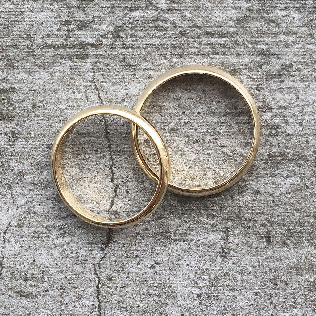 Gold wedding bands, womens. Two polished gold wedding band rings with court profiles; minimalist, classic and simple 