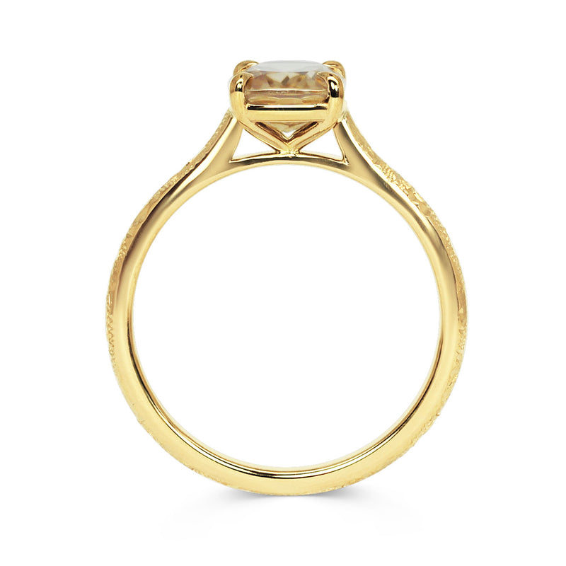 Lebrusan Studio solitaire engagement ring with hand-engraved 18ct recycled gold band and a cushion-cut gold zircon of traceable fair trade provenance